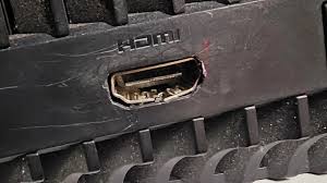 Externally damaged PS5 HDMI port showing bent and broken internal pins